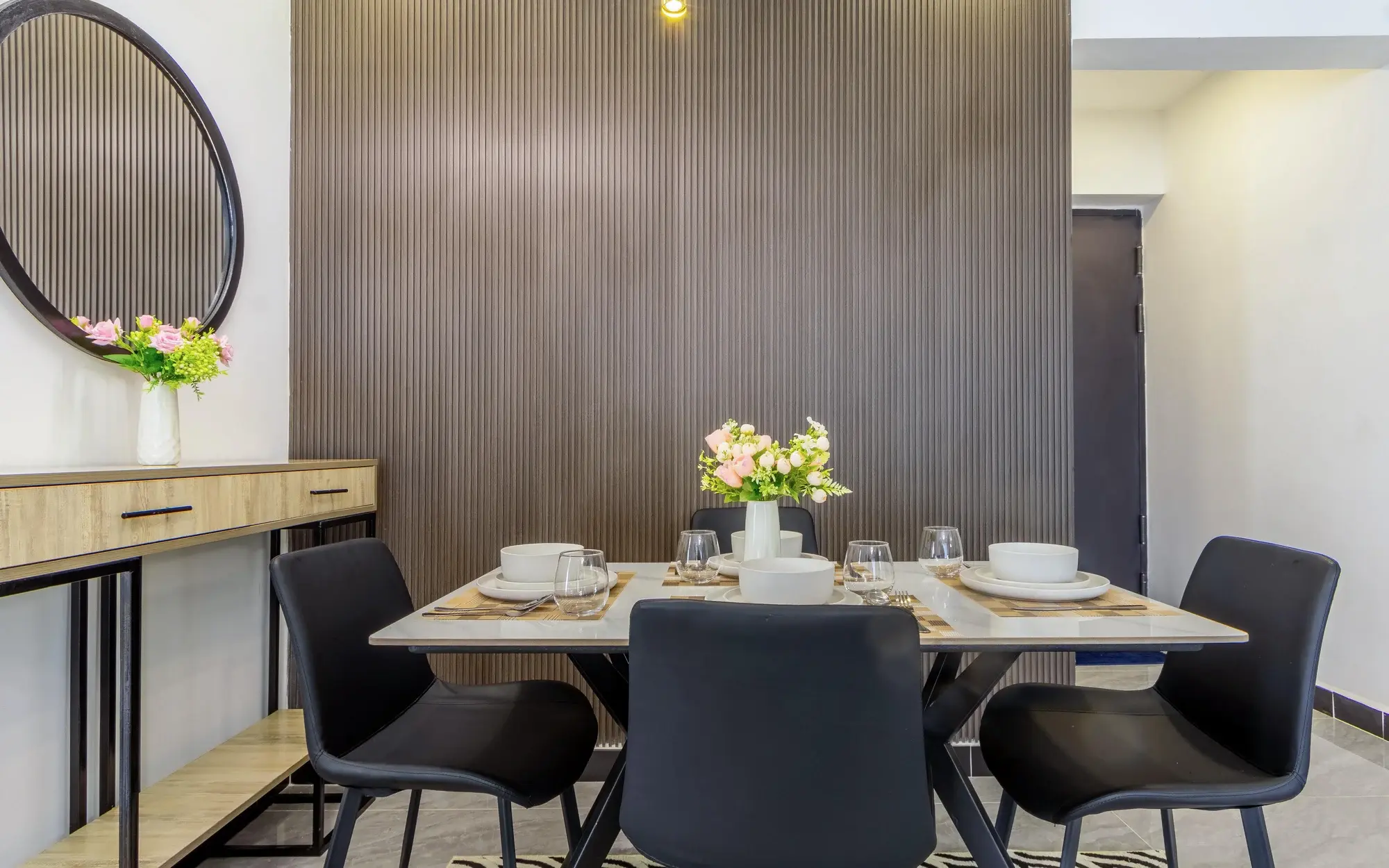 Evara's dining table and timber-panelled wall